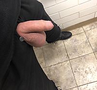 Semi in a public washroom. Freshly shaved balls hanging really low.