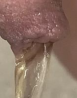 Pissing through foreskin closeup 1